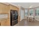 Modern kitchen featuring stainless steel refrigerator and ample cabinetry at 20193 Pezzana Dr, Venice, FL 34292