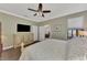 Comfortable bedroom featuring a king bed and ensuite access at 20193 Pezzana Dr, Venice, FL 34292