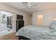 Bedroom with a queen bed, dresser, and access to a patio at 612 Albee W Rd, Nokomis, FL 34275
