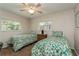 Guest bedroom with twin beds and window views at 612 Albee W Rd, Nokomis, FL 34275