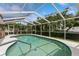 Relaxing screened-in pool area with lounge chairs at 612 Albee W Rd, Nokomis, FL 34275