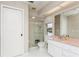 Bathroom with pink vanity, shower, and separate toilet at 612 Albee W Rd, Nokomis, FL 34275