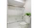 Clean bathroom with a shower/tub combo and white tile at 612 Albee W Rd, Nokomis, FL 34275