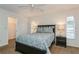 Bedroom with a queen-size bed, nightstands, and closet at 612 Albee W Rd, Nokomis, FL 34275