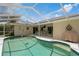Relaxing pool area with patio furniture and grill at 612 Albee W Rd, Nokomis, FL 34275