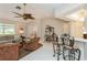 Living area with comfy seating and access to kitchen at 612 Albee W Rd, Nokomis, FL 34275