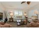 Living room with comfy seating and a large TV at 612 Albee W Rd, Nokomis, FL 34275