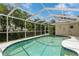 Inviting screened pool area with a spacious deck at 612 Albee W Rd, Nokomis, FL 34275