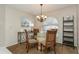 Bright dining room featuring a glass table and four chairs at 612 Albee W Rd, Nokomis, FL 34275