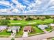 Single Gathering home with brown roof and attached garage in a golf course community at 1411 Strada D Argento, Venice, FL 34292