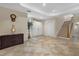 Bright entryway with tile flooring, double doors, and staircase at 8188 Shadow Pine Way, Sarasota, FL 34238