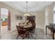 Bright dining area with a wood table and chairs near the kitchen at 8188 Shadow Pine Way, Sarasota, FL 34238