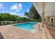 Expansive pool and patio area, offering serene views at 8188 Shadow Pine Way, Sarasota, FL 34238