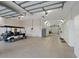 Large garage with ample storage and a golf cart at 1040 Gulf Winds Way, Nokomis, FL 34275
