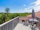 Relax on this private deck overlooking lush tropical landscape at 1040 Gulf Winds Way, Nokomis, FL 34275