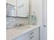 Clean bathroom with a white vanity and subway tile at 1040 Gulf Winds Way, Nokomis, FL 34275