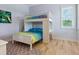 Charming bedroom with built-in bunk beds and a desk at 1040 Gulf Winds Way, Nokomis, FL 34275