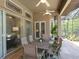 Relaxing patio with seating area and lush greenery at 1040 Gulf Winds Way, Nokomis, FL 34275