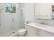 Clean bathroom with a walk-in shower and modern vanity at 1040 Gulf Winds Way, Nokomis, FL 34275