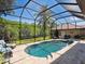 Inviting screened pool with spa and ample deck space at 1040 Gulf Winds Way, Nokomis, FL 34275