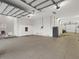 Spacious three-car garage with overhead storage at 1040 Gulf Winds Way, Nokomis, FL 34275