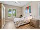 Spacious bedroom with wood floors and large windows offering natural light at 1040 Gulf Winds Way, Nokomis, FL 34275