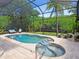 Relaxing pool and spa with plenty of lounge chairs at 1040 Gulf Winds Way, Nokomis, FL 34275