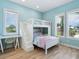 Spacious bedroom with a built-in bunk bed and ample natural light at 1040 Gulf Winds Way, Nokomis, FL 34275