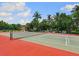 Enjoy a game of tennis on this well-maintained court at 1040 Gulf Winds Way, Nokomis, FL 34275