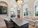 Home office with large desk and comfortable seating area at 1040 Gulf Winds Way, Nokomis, FL 34275