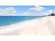 Stunning beach view with white sand and clear water at 1040 Gulf Winds Way, Nokomis, FL 34275