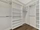 Walk-in closet with ample shelving and hanging space at 137 Bella Vista Ter # 33B, Nokomis, FL 34275