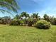 Lush tropical landscaping in the backyard at 10079 Crooked Creek Dr, Venice, FL 34293