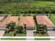 Aerial view showing multiple houses with similar architectural design and landscaping at 10079 Crooked Creek Dr, Venice, FL 34293