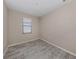 Simple bedroom with neutral walls and tile flooring at 10079 Crooked Creek Dr, Venice, FL 34293