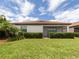 Private backyard with lush landscaping and spacious lawn at 10079 Crooked Creek Dr, Venice, FL 34293