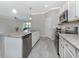 Modern kitchen featuring granite countertops, stainless steel appliances, and an island at 10079 Crooked Creek Dr, Venice, FL 34293