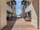 Brick courtyard with tables and chairs, nestled between buildings at 10079 Crooked Creek Dr, Venice, FL 34293