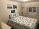 Comfortable bedroom with seashell themed bedding and wall art at 209 Roma Rd, Venice, FL 34285