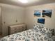 Cozy bedroom featuring seashell themed bedding and beach-themed art at 209 Roma Rd, Venice, FL 34285