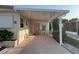 Covered carport featuring outdoor seating and tropical decor at 209 Roma Rd, Venice, FL 34285