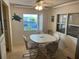Cozy dining area features a window and comfortable seating for four at 209 Roma Rd, Venice, FL 34285