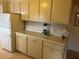 Well-maintained kitchen with light countertops and appliances at 209 Roma Rd, Venice, FL 34285