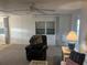 Relaxing living room with neutral decor and large windows providing ample light at 209 Roma Rd, Venice, FL 34285