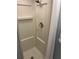 Close up of standing shower stall with showerhead, controls and curtain at 209 Roma Rd, Venice, FL 34285