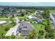 An aerial view of a residential area featuring a home with a screened-in pool at 2091 Marlin Way, Englewood, FL 34224