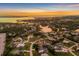 Stunning aerial view of waterfront homes, canals and a picturesque landscape at sunset at 2091 Marlin Way, Englewood, FL 34224