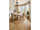 Charming breakfast nook featuring a round table, wicker chairs, and natural light from the window at 2091 Marlin Way, Englewood, FL 34224