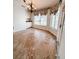 Cozy dining area with a decorative chandelier and bay windows offering picturesque views of the outdoors at 2091 Marlin Way, Englewood, FL 34224