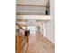 Spacious foyer with travertine tile, a wrought iron staircase, and an open view to the living and dining areas at 2091 Marlin Way, Englewood, FL 34224